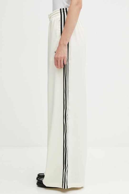 adidas Originals spodnie dresowe Satin Tp Wl dzianina beżowy KD2542
