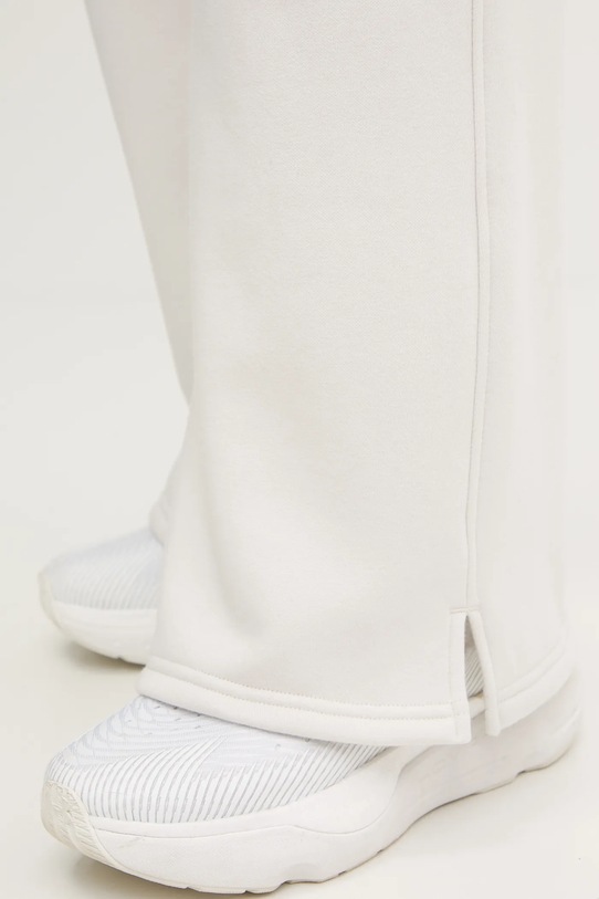 Under Armour spodnie dresowe Icon Vida 6004853 beżowy