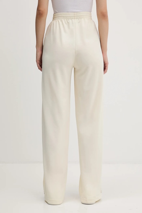 adidas Originals spodnie dresowe Firebird beżowy KA7744