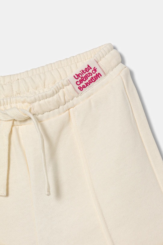 Dziewczynka United Colors of Benetton spodnie dresowe bawełniane dziecięce 3NBMGF04Y.P.seasonal beżowy