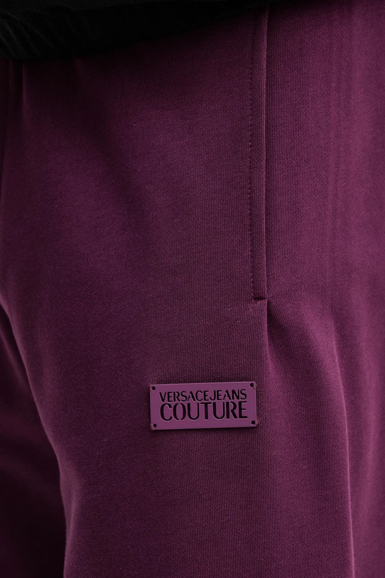 Хлопковые спортивные штаны Versace Jeans Couture фиолетовой 79GAAT07.CF01T