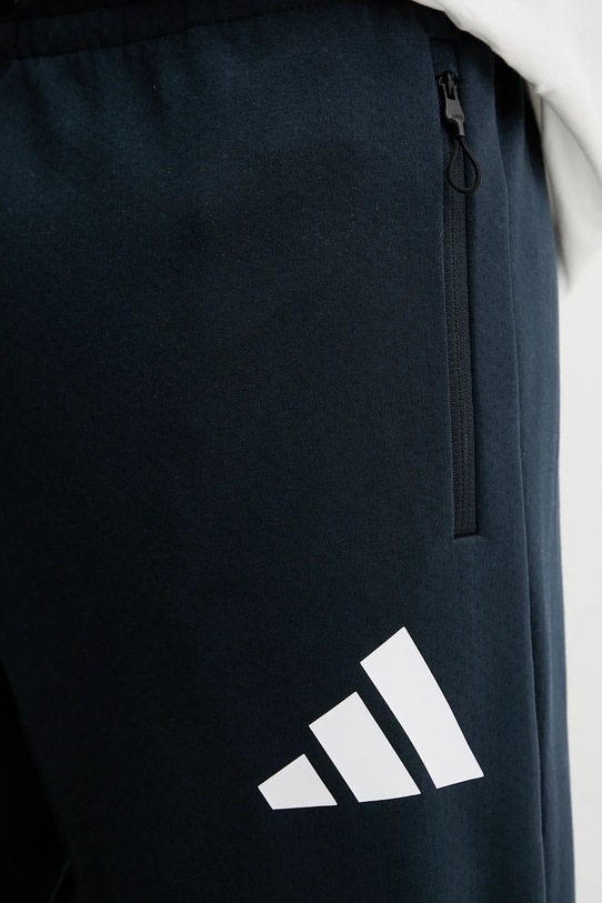Tepláky adidas x Z.N.E modrá JW4723