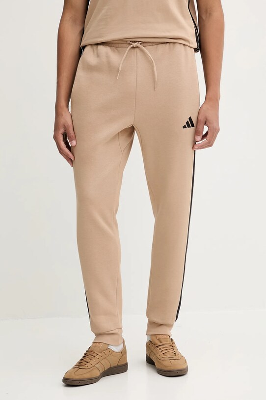 adidas spodnie dresowe Essentials dzianina beżowy JX0712