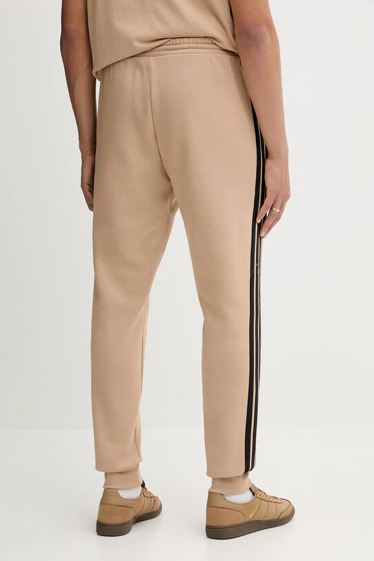 Odzież adidas spodnie dresowe Essentials JX0712 beżowy