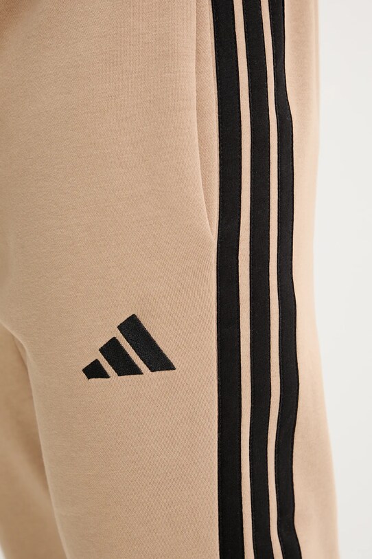 adidas spodnie dresowe Essentials beżowy JX0712