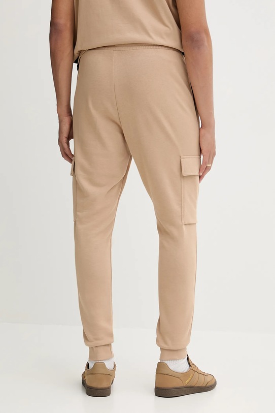 Odzież adidas spodnie dresowe Feelcozy JX3332 beżowy