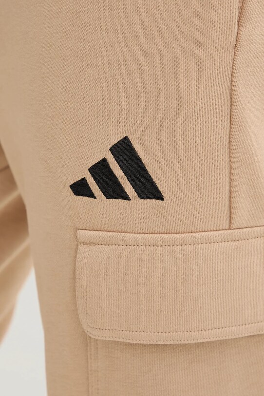 adidas spodnie dresowe Feelcozy beżowy JX3332