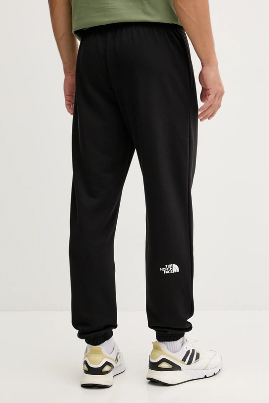 Ruházat The North Face melegítőnadrág Simple Dome NF0A8C41JK31 fekete