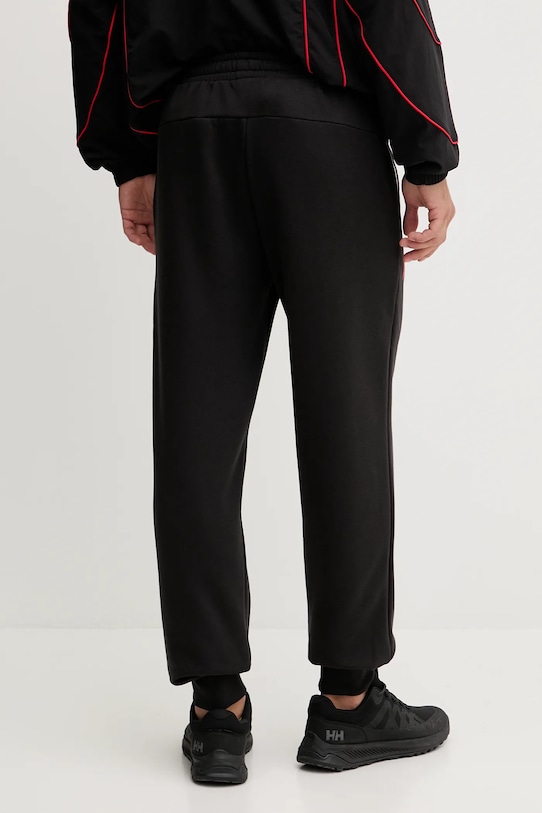 Îmbrăcăminte Puma pantaloni de trening x F1 630123 negru