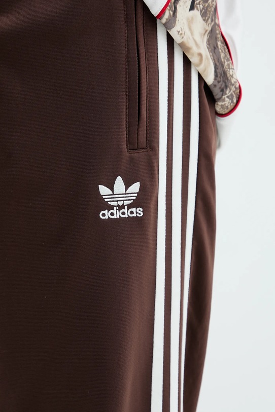 Spodnji del trenirke adidas Originals Firebird Tp rjava KA0482