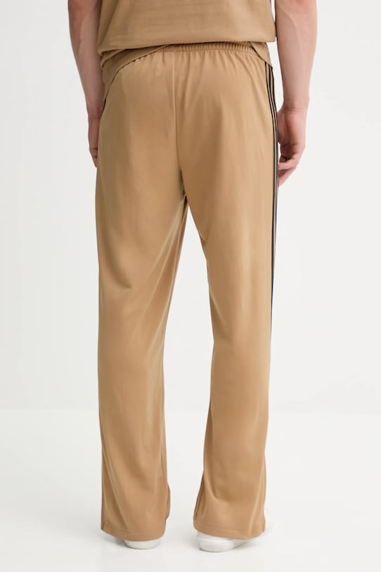 Odzież adidas Originals spodnie dresowe Firebird Tp JY6369 beżowy