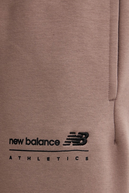 New Balance spodnie dresowe brązowy MP53508EAS