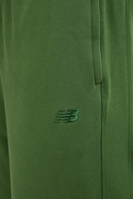 New Balance spodnie dresowe bawełniane zielony MP41508DAE