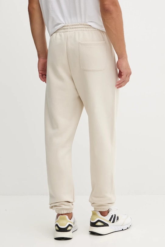 Ρούχα Παντελόνι φόρμας New Balance MP41503TWF μπεζ
