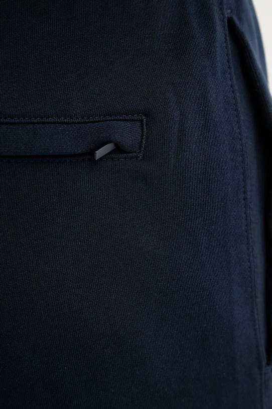 Pamučni donji dio trenirke Calvin Klein Jeans LV04RD241G mornarsko plava