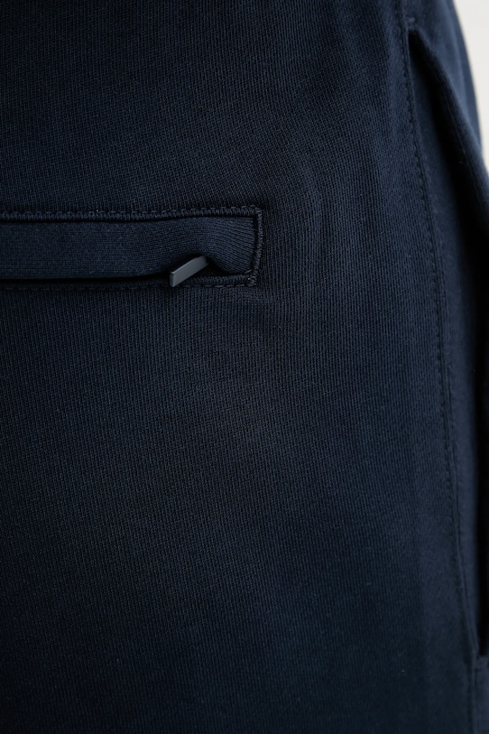 Pamučni donji dio trenirke Calvin Klein Jeans LV04RD241G mornarsko plava