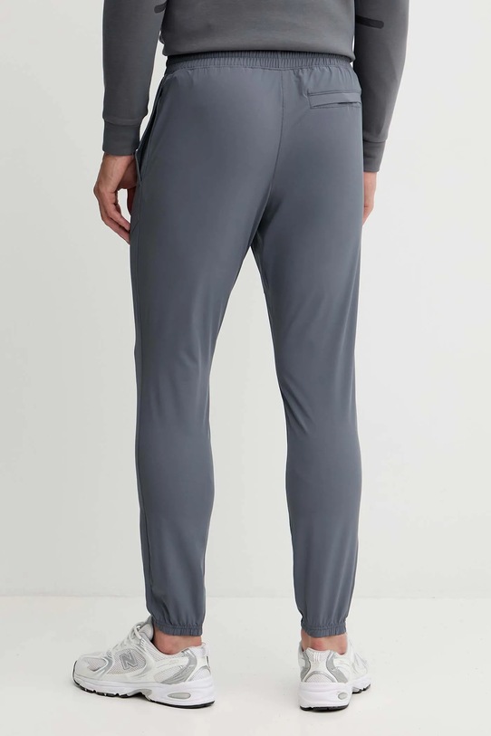 Odzież Under Armour spodnie dresowe Vibe Woven 1386557 szary