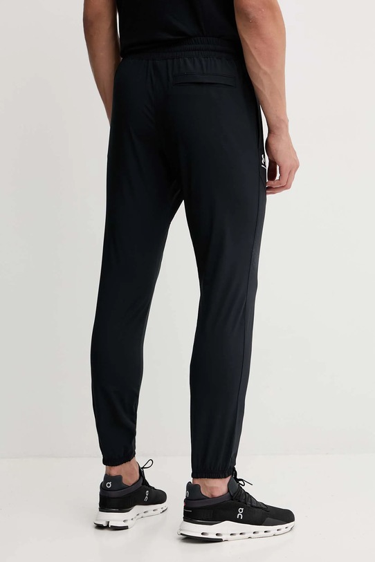 Odzież Under Armour spodnie dresowe Vibe Woven 1386557 czarny