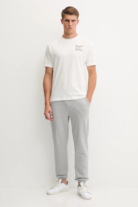 Bavlnené tričko New Balance MT53921SST béžová AW25