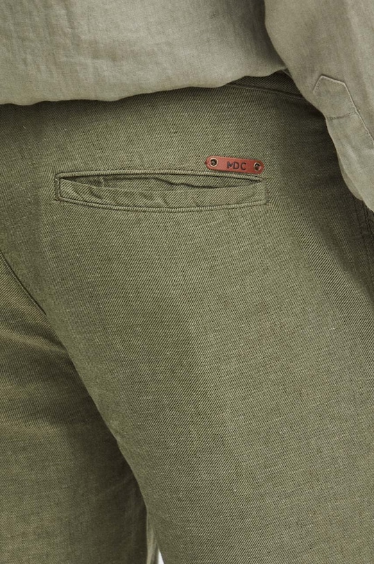 Plátěné kalhoty pánské tapered zelená barva zelená RS24.SPM900