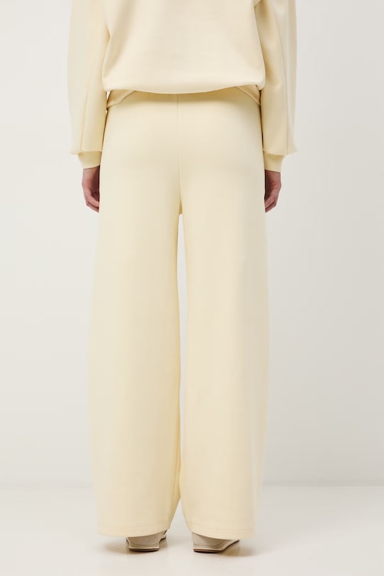 Odzież spodnie dresowe damskie RS26-SPD602 żółty