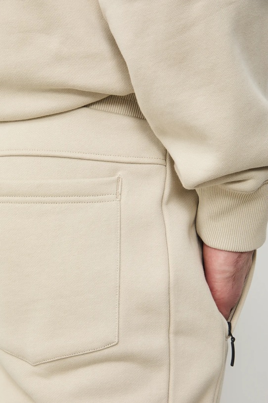 Medicine spodnie dresowe męskie bawełniane beżowy RS26-SPM031