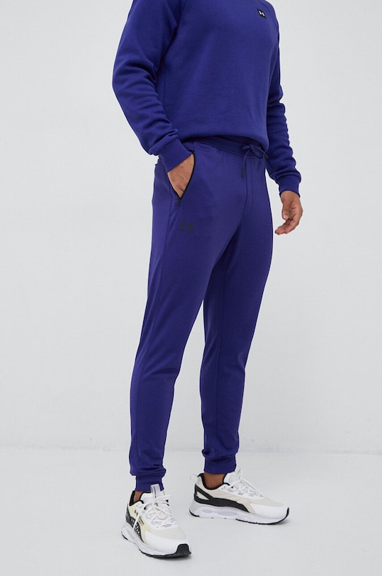 Under Armour spodnie dresowe dzianina fioletowy 1290261