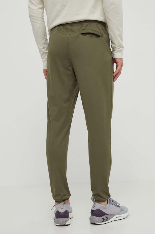 Odzież Under Armour spodnie dresowe 1290261 zielony
