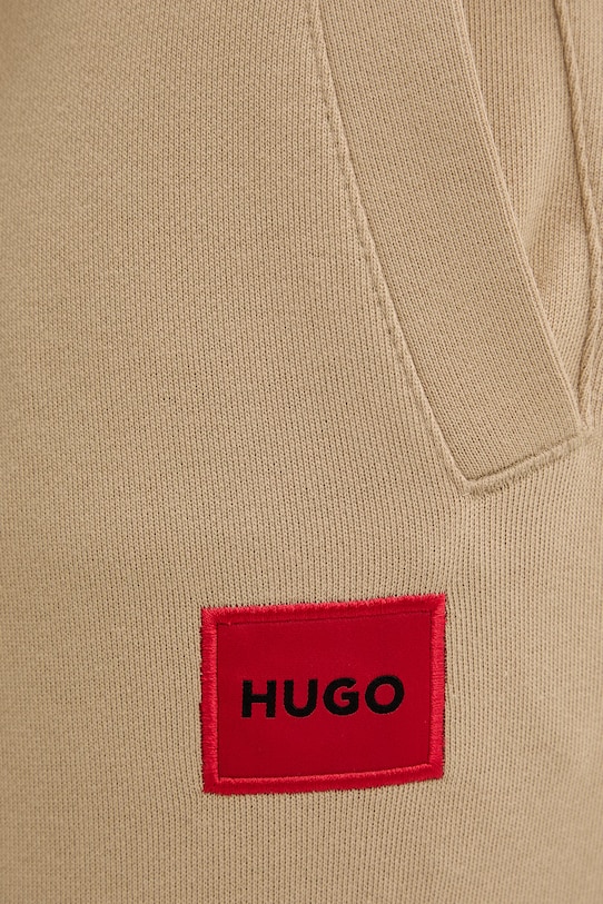 HUGO spodnie dresowe bawełniane Doak212 beżowy 50447963