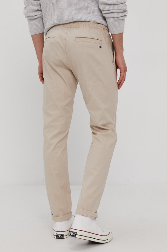 Odzież Tommy Jeans Spodnie DM0DM10125.4891 DM0DM10125.4891 beżowy