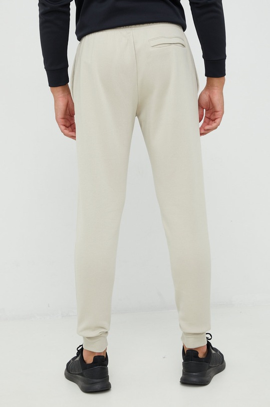 Under Armour spodnie 1357128 beżowy SS23