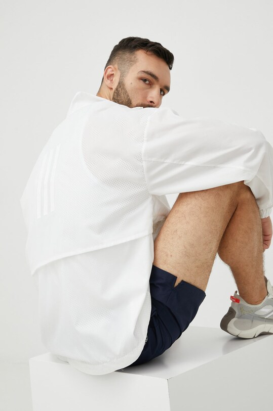 Větrovka adidas Performance Traveer bez kapuce bílá H48579