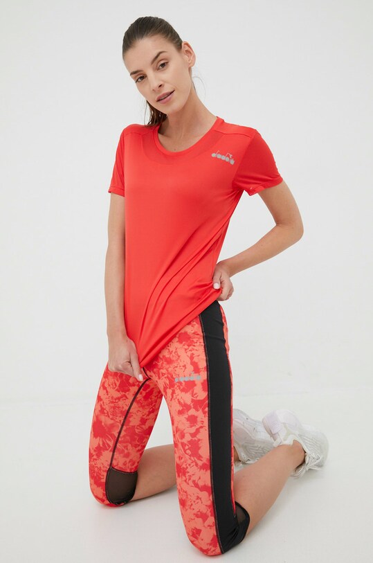 Diadora legginsy do biegania Be One 102.178143 pomarańczowy SS22