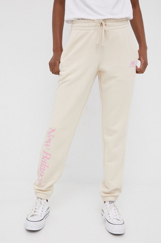 New Balance spodnie dresowe WP21508CTU dzianina beżowy WP21508CTU