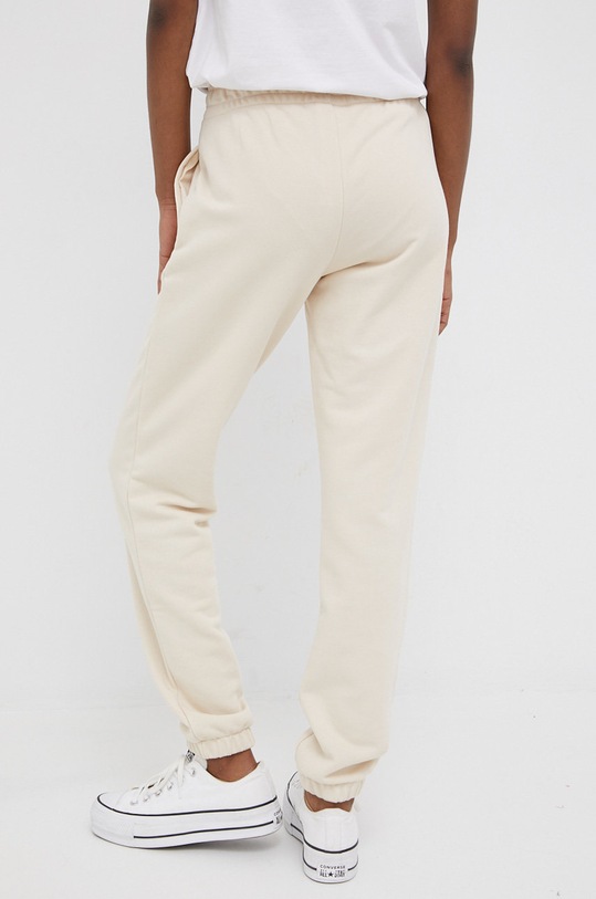 New Balance spodnie dresowe WP21508CTU WP21508CTU beżowy SS22