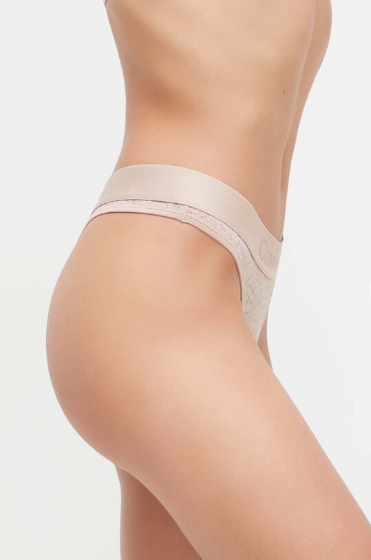 Calvin Klein Underwear stringi 000QF7287E.PPYX beżowy AW23