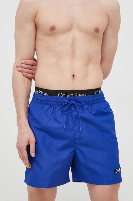 Kratke hlače za kupanje Calvin Klein bez uzorka plava KM0KM00815.PPYX