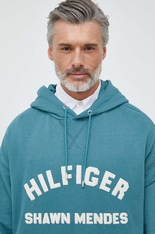 Mikina Tommy Hilfiger x Shawn Mendes tyrkysová MW0MW31185.PPYX