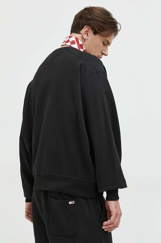 Ruházat Tommy Jeans pamut melegítőfelső DM0DM16376.PPYX fekete
