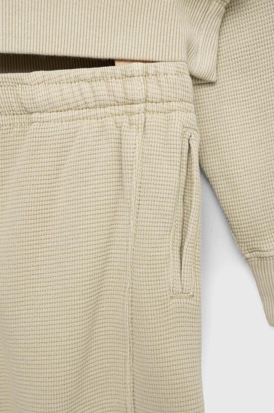 Pamučna dječja trenirka Calvin Klein Jeans IB0IB01625.PPYX bež