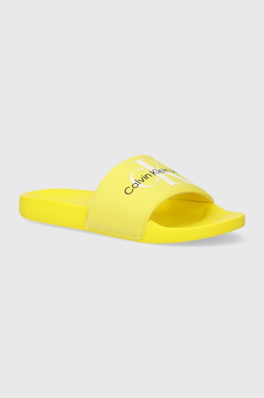 Pantofle Calvin Klein Jeans SLIDE MONOGRAM CO textilní žlutá YW0YW00103