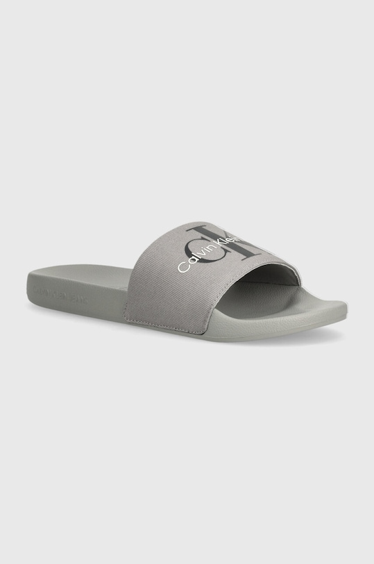 Šľapky Calvin Klein Jeans SLIDE MONOGRAM CO sivá YM0YM00061
