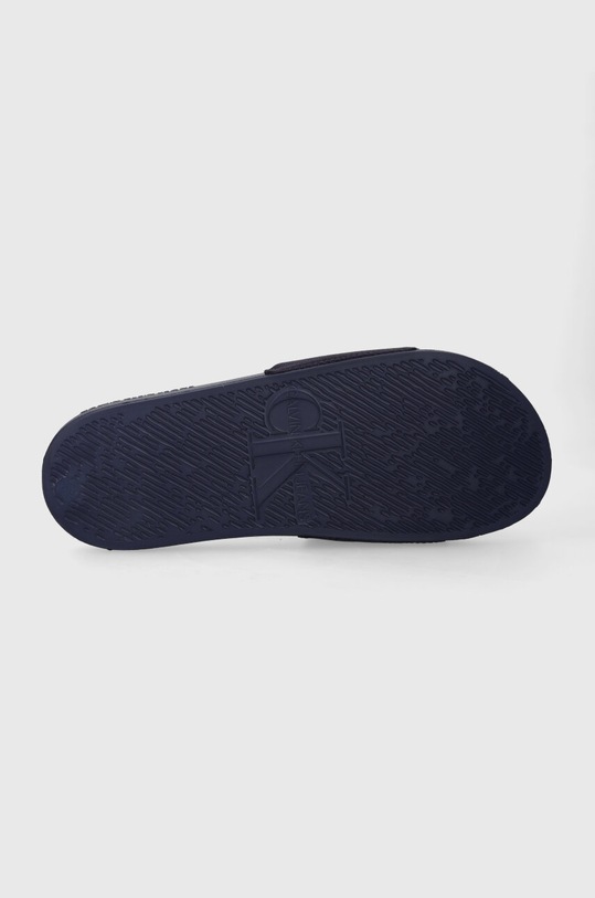 Natikači Calvin Klein Jeans SLIDE MONOGRAM CO YM0YM00061 mornarsko modra