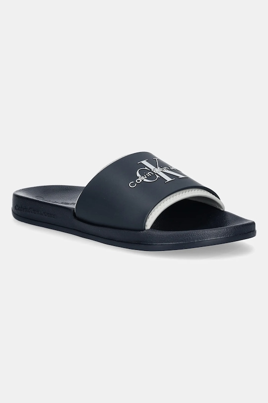 Natikači Calvin Klein Jeans SLIDE MONOGRAM TPU mornarsko modra YM0YM00361