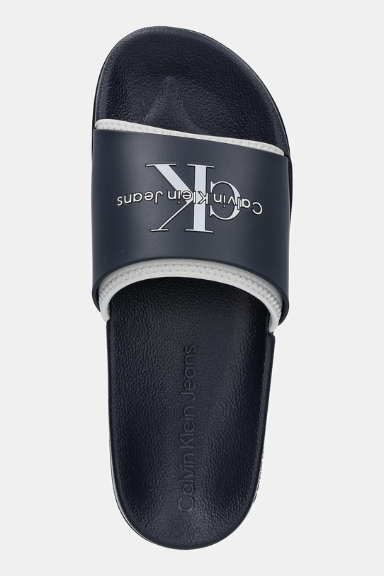 Natikači Calvin Klein Jeans SLIDE MONOGRAM TPU mornarsko modra YM0YM00361