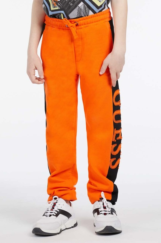 Detské bavlnené tepláky Guess L3RQ24.KA6R3.PPYX oranžová
