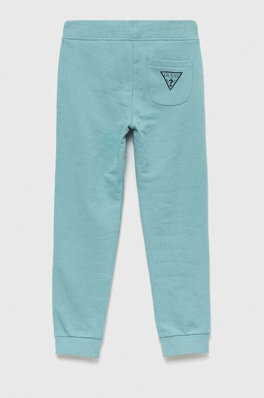 Guess spodnie dresowe bawełniane dziecięce N93Q17.KAUG0.PPYX turkusowy SS23
