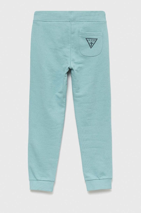 Dětské bavlněné tepláky Guess L93Q24.KAUG0.PPYX tyrkysová SS23