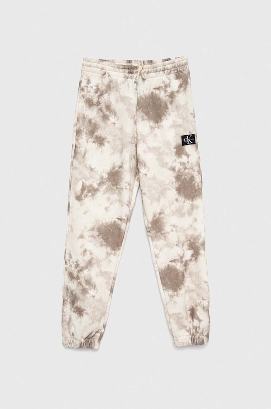 Calvin Klein Jeans spodnie dresowe dziecięce aplikacja beżowy IB0IB01602.PPYX