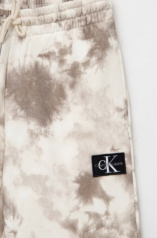 Chłopiec Calvin Klein Jeans spodnie dresowe dziecięce IB0IB01602.PPYX beżowy